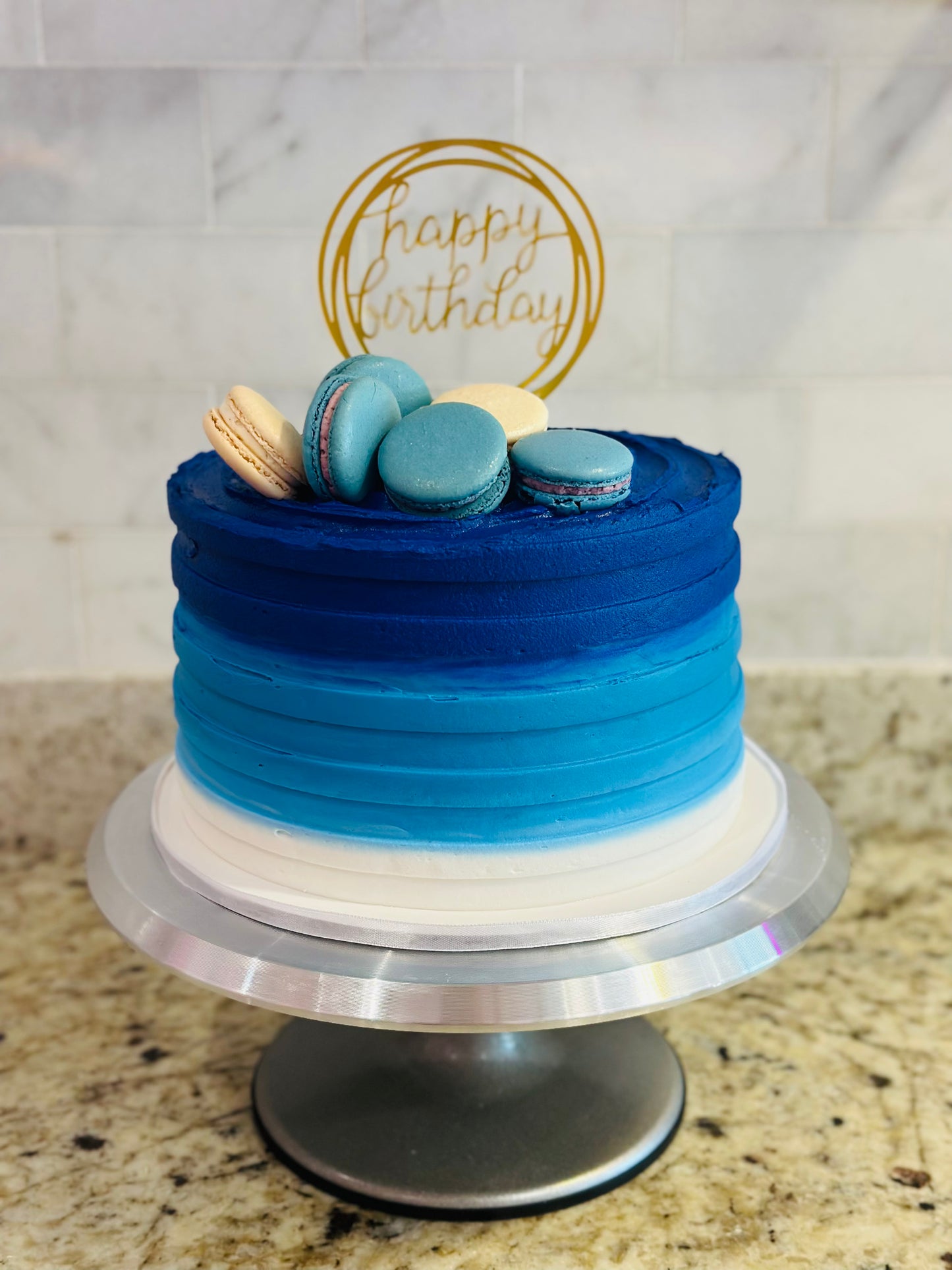 Signature butter-cream top-macaron custom cake